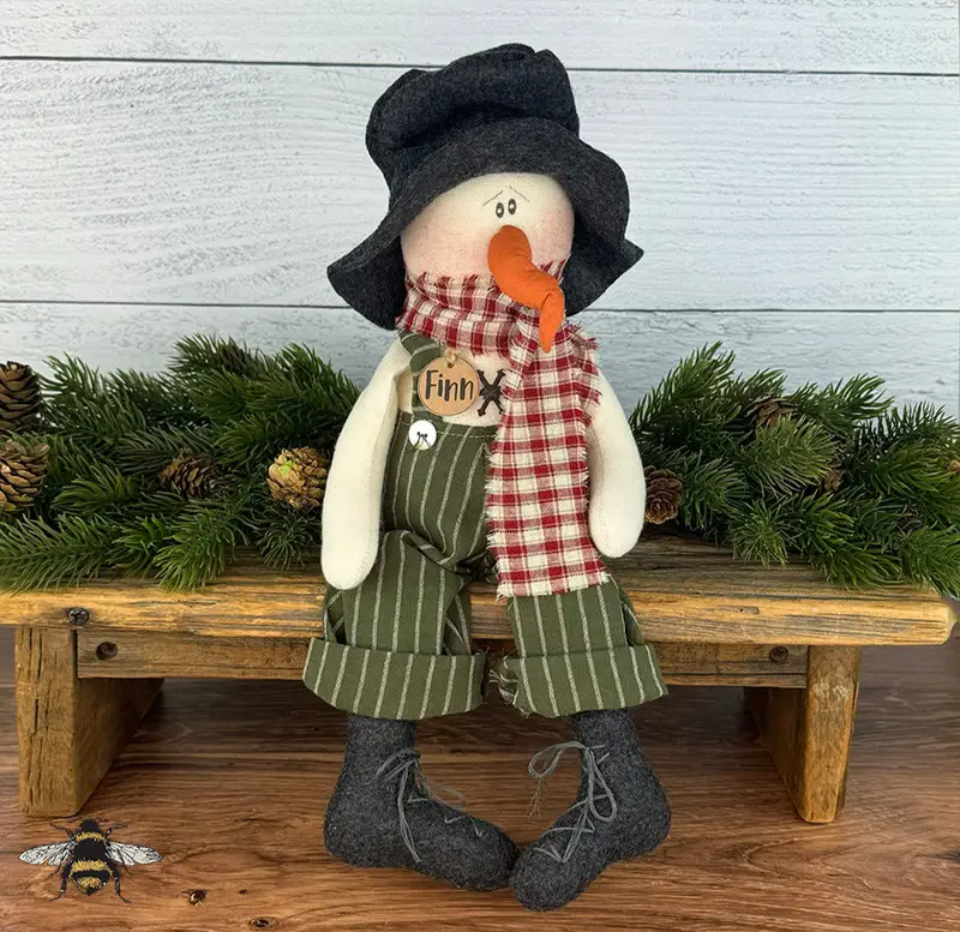 Honey and Me Finn the Snowman plush wearing a felt hat, plaid scarf, and striped overalls